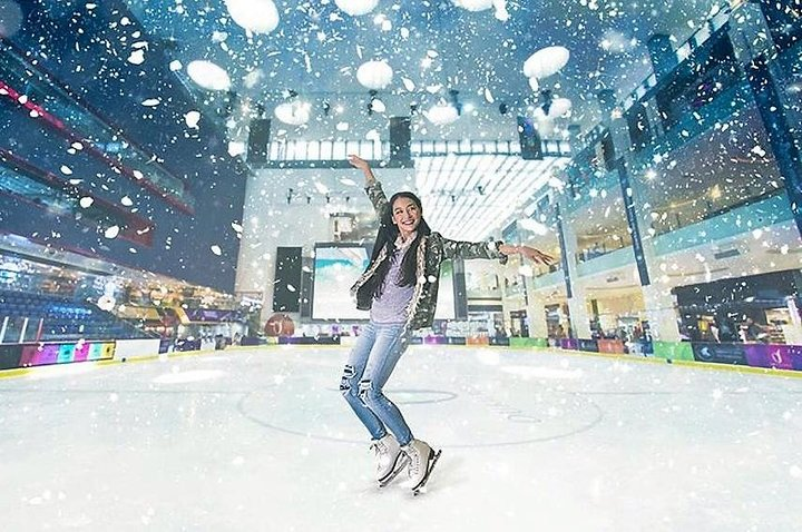Experience a winter wonderland year-round at Dubai Mall's indoor ice rink where skaters of all ages glide gracefully beneath a mesmerizing ceiling and falling snowflakes. Fun awaits!